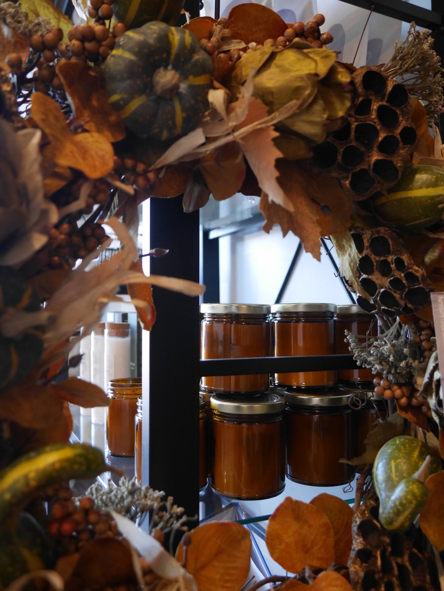 Display shelf with amber glass candles