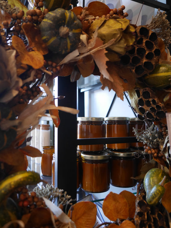Display shelf with amber glass candles