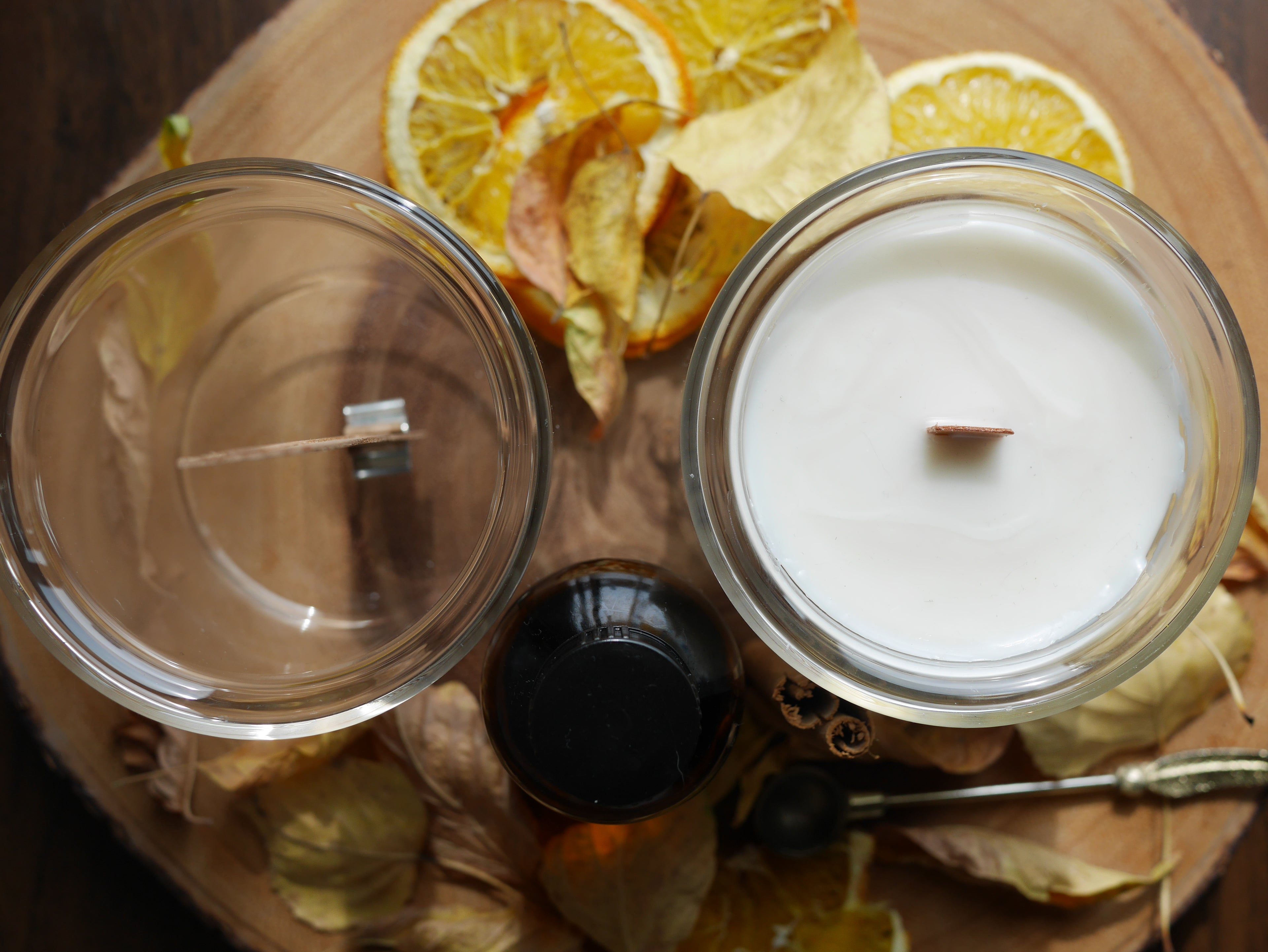 Two candles, one empty one filled